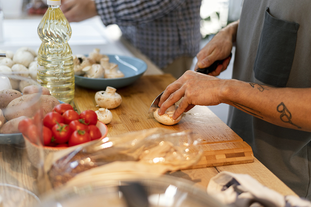 close-up-hand-cutting-mushrooms.jpg